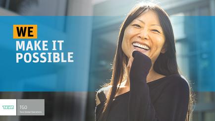 A digital graphic with a blue background and white text that reads "WE MAKE IT POSSIBLE". On the right side of the image there is a photo of a young Asian woman with long dark hair smiling widely and laughing. She is wearing a black top and has her hand on her chin as if she is deep in thought. The background is blurred but it appears to be an outdoor setting with a building visible in the distance. The text on the image is in a bold font and is centered.
