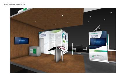 A 3D rendering of a hospitality area view of a trade show booth. The booth is located in a room with a wooden floor and a high ceiling with recessed lighting. On the left side of the booth there is a large screen mounted on the wall and a small desk with a computer monitor on it. In front of the desk there are two large banners with a green and white design. The banners have text and images on them and one of them has a blue and green circular design with the words "Hospitality Area View" written in white. There is also a small table and chairs in the background.