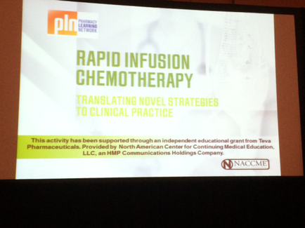 A slide from a presentation on rapid infusion chemotherapy. The slide has a white background with green text. The title of the slide reads "Rapid Infusion Chemotherapy: Translating Novel Strategies to Clinical Practice". Below the title there is a subtitle that reads "This activity has been supported through an independent educational grant from tea Pharmaceuticals provided by North American Center for Continuing Medical Education LLC an HMP Communications Holdings Company." The slide also has the logo of the company on the top left corner.