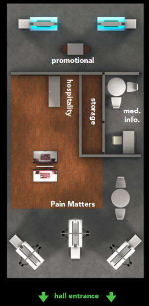 A 3D floor plan of a hospital room. The room has a large wooden floor with a reception desk on the left side. On the right side of the room there is a desk with a computer monitor and a chair. Above the desk there are two blue boxes with the words "promotional" and "hospitality" written on them. Below the boxes it says "storage" and below that "med. info." There are also two white tables and chairs in the room. At the bottom of the image there appears to be a hall entrance. The image is labeled "Pain Matters" and has a green arrow pointing downwards.