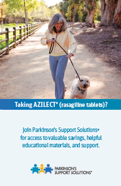 A woman walking her dog on a path in a park. She is wearing a yellow jacket and blue jeans and is holding a black leash attached to the dog's collar. The dog is a small white terrier with a blue collar and is walking on the path. The background shows trees and a wooden fence on the left side of the image. The image is accompanied by text that reads "Taking anilest (rosaniline tablets?) Join Parkinson's Support Solutions for access to valuable savings helpful educational materials and support."