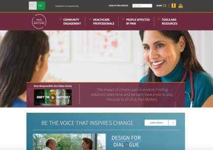 A screenshot of the homepage of a website called "Design for Dialogue". The website has a purple and white color scheme with a navigation bar at the top. Below the navigation bar there is a navigation menu with various options such as "Community Engagement" "Healthcare Professionals" "People Affected" "Tools and Resources" and "New Responsible Use Video Series". On the left side of the page there are two women engaged in a conversation one with long dark hair and the other with short dark hair. The woman with the long hair is wearing a blue shirt and has a stethoscope around her neck. She is smiling and looking at the other woman with a friendly expression. At the bottom of the image there has a banner with the text "Be the voice that inspires change" and an image of a man and a woman talking to each other. The banner also has a button that says "Design For Dialogue".