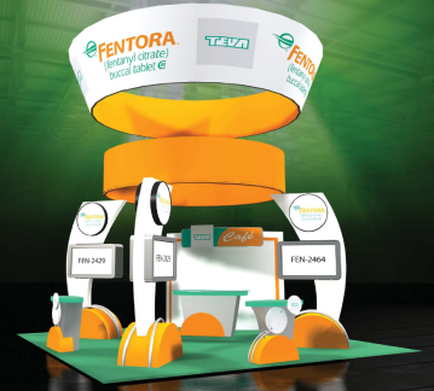 A trade show booth with a green background. The booth has a white and orange color scheme with the word "mentor" written in bold orange letters at the top. Below the word there is a large orange banner with the company's logo and contact information. On the left side of the booth there are two white booths with orange accents one with a sign that reads "FEN-2424" and the other with a blue and white sign that says "came". On the right side the booth has two smaller booths with the same logo and text. There are also two small white tables with orange and white signs that read "Café". The booth is set up on a green carpeted floor.