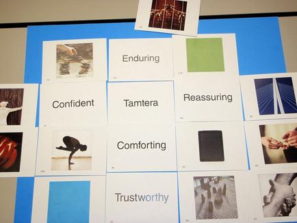 A collage of multiple photographs arranged in a grid-like pattern on a blue background. The photographs are arranged in two rows and three columns. The first row of photographs on the top left shows a black and white photograph of a person standing on a rock with their arms stretched out to the side. The second row shows a group of people standing on top of a mountain with their hands in the air. The third row shows two people holding hands and looking up at the sky. The fourth row shows three people standing in front of a green square with the word "Enduring" written on it. The fifth row shows the words "Confident" "tamera" "Reassuring" "Comforting" and "Trustworthy" written below each photograph. Overall the image appears to be a visual representation of the concept of enduring tamera and reassuring.