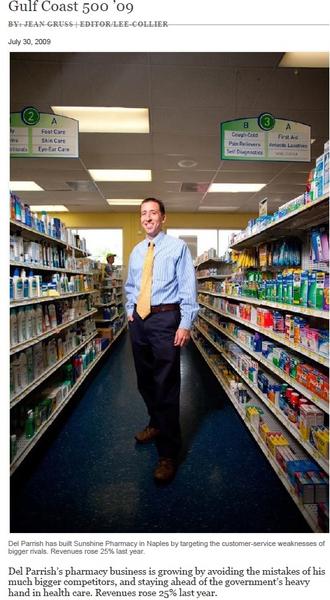 A man standing in the aisle of a pharmacy. He is wearing a blue shirt a yellow tie and dark pants. He has a smile on his face and is looking directly at the camera. The aisle is filled with shelves stocked with various medicines and products. Above the aisle there is a sign that reads "Gulf Coast 500'09" and below the sign it reads "Del Parrish has built Sunshine Pharmacy in Naples by targeting the customer-service weakness. Del parish's pharmacy business is growing by avoiding the mistakes of his customers. He also has a list of the top 10 companies in the Gulf Coast.