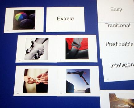 A collage of six photographs arranged in a grid-like pattern on a blue background. The photographs are arranged in two rows and three columns. The first photograph on the top left shows a colorful ball with the word "extreme" written on it. The second photograph is a close-up of a person's hand holding a small object. The third photograph is of a hand holding another hand. The fourth photograph is from the top right corner of the collage. The fifth photograph is in the center of the image and shows a person wearing a red jacket and a black belt. The sixth photograph is on the bottom left corner and shows two hands holding each other. The seventh photograph is at the bottom right corner and is of an airplane flying in the sky. There are also two words written on the right side of each photograph that read "Easy" "Traditional" "Predictable" and "Intelligent". These words are likely related to the concept of "extreme".