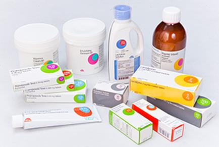 A collection of medical supplies including two white plastic containers with lids a white bottle with a blue cap a brown bottle with orange liquid and several small white boxes with colorful labels. The containers are arranged in a scattered manner with some of them overlapping each other. The labels on the containers have different colors and designs including pink blue green yellow and orange. There is also a tube of toothpaste in the bottom left corner of the image. The background is plain white.