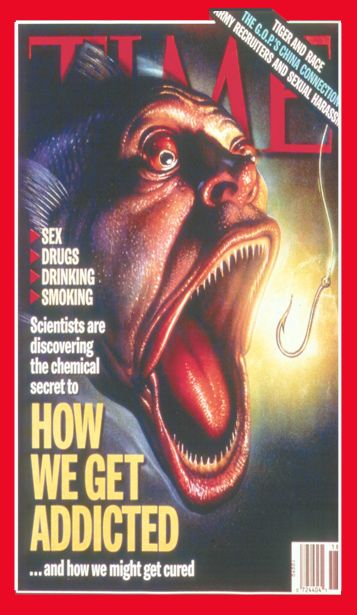 The cover of a Time magazine. The cover features a close-up of a large fish with a human face. Its mouth open wide about to be caught on a fish hook. The background is dark and the magazine title is written in bold red letters at the top of the cover. Below the title there is text that reads "Sex Drugs Drinking Smoking Scientists are discovering the chemical secret to how we get addicted...and how we might get cured."