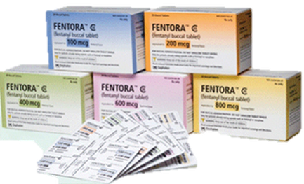 A group of six boxes of mentor G tablets. The boxes are arranged in a pyramid-like formation with the top box being the largest and the bottom two boxes being the smallest. Each box has a different color and label on it. The first box is blue the second box is orange the third box is pink the fourth box is yellow the fifth box is green the sixth box is purple and the seventh box is white. The label on the boxes reads "mentor G" in bold letters followed by "100 mg" in smaller letters "200 mg" "600 mg" and "800 mg". There are also a few small packets of the tablets scattered around the boxes. The packets appear to be new and unused with some of them still in their original packaging. The background is a light green color.