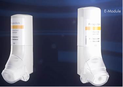 Two white electronic devices one on the left and the other on the right side by side. The devices are cylindrical in shape and appear to be made of plastic. The left device has a label on it that reads "Polaroid" and has a yellow and orange color scheme. The label also has some information about the device such as its size capacity and other specifications. The right device has the word "E-Module" written on it indicating that it is an E-Module. Both devices have a sleek and modern design. The background is dark blue making the devices stand out.