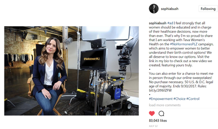 A screenshot of an Instagram post by actress Sophia Bush. The post is about Sophia Bush a woman who is known for her work in the field of woman's rights. She is sitting on a chair in front of a camera and a video camera setup. Sophia Bush is wearing a navy blue blazer and jeans and is smiling at the camera. The background appears to be a studio or studio setting with a brick wall and a large window. The text on the post reads "Sophia Bush: I feel strongly that all women should be educated and in charge of their health. I am working with the woman's Rights Campaign which aims to empower women to better understand their rights and promote their rights."