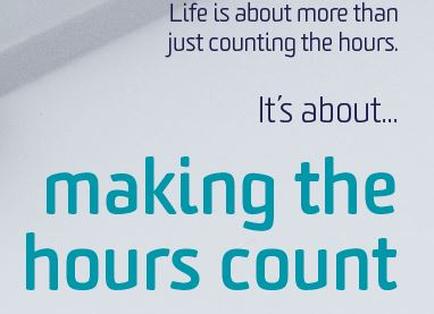 A text-based graphic with a white background and blue text. The text reads "Life is about more than just counting the hours. It's about... making the hours count." The text is in a bold sans-serif font and is centered on the image. The word "making" is slightly larger than the rest of the text and is slightly slanted to the right. The overall design is simple and minimalist.
