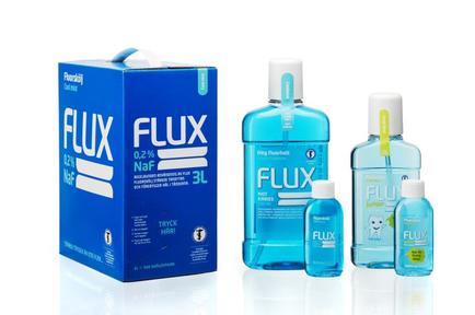 A blue box with the word "Flux" written on it in white letters. The box is rectangular in shape and has a handle on the top for easy carrying. On the left side of the box there is a label that reads "0.2% NaF 3L". On the right side there are three bottles of the same product - one with a white cap and the other with a blue cap. The bottles are arranged in a line with the first bottle on the left the second bottle in the middle and the third bottle at the bottom. The background is white.