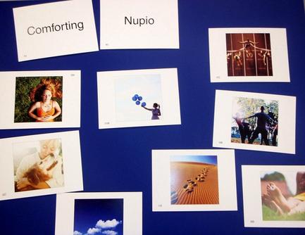 A collage of nine photographs arranged in a grid-like pattern on a blue background. The photographs are arranged in two rows and three columns. The first row of photographs on the top left shows a woman with red hair wearing an orange dress and smiling. The second row shows a group of people dancing in a park with a blue sky and clouds in the background. In the third row there is a photograph of a person holding a blue balloon. The fourth row shows two people holding hands and dancing with one person holding the balloon and the other holding a camera. The fifth row shows three people walking on a sandy beach with the sun shining brightly in the top right corner. The sixth row shows four people walking in the same direction with their arms around each others shoulders. The seventh row shows five people walking away from the camera and the eighth row shows six people walking towards the camera.
