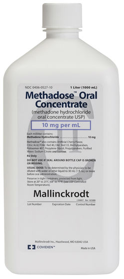 A closeup of packaging for Methadose Oral Concentrate (methadone hydrochloride oral concentrate USP) 10 mg per mL by Mallinckrodt. It is a white plastic bottle with a white cap with a white label with black and blue text. The logos for Mallinckrodt and Covidien are both at the bottom.