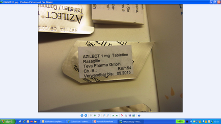 A close-up of a label on a white surface. The label is rectangular in shape and has black text written on it. The text reads "anilest 1 mg Tabletten" which translates to "Tabletten" in English. Below the text there is a description of the product which is "tea dharma GmbH". The label also mentions that the product is "Ch.B. Verwendebar bis. 09.2015". The background of the image is blurred but it appears to be a desk or table with other medical supplies scattered around.