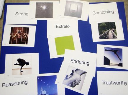 A collage of multiple photographs arranged in a grid-like pattern on a blue background. There are nine photographs in total arranged in two rows and three columns. The first photograph on the top left is a black and white photograph of a person standing on their hind legs with their arms stretched out in front of them. The second photograph is a square with the word "Strong" written on it. The third photograph is of a group of people standing on a bridge with their hands in the air. The fourth photograph is from the top right corner of the collage. The fifth photograph is in the center of the grid and shows a person in a yoga pose. The sixth photograph is on the bottom left corner and the seventh photograph is at the bottom right corner. There are also several smaller photographs scattered throughout the image each with a different word written on them. Some of the words "Comforting" "extreme" "Enduring" "Reassuring" and "Trustworthy" are written below the images.