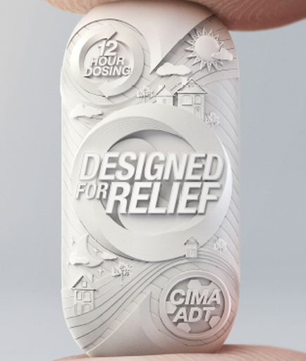 A close-up of a person's hand holding a white object with a circular design on it. The design is made up of various elements including a sun a house a tree and a wave-like pattern. The text on the object reads "12 Hour Dosing" and "Designed for Relief" in a bold sans-serif font. Below the text there is a smaller text that reads "coma ADT". The overall design is modern and minimalist with a focus on the text and the elements.