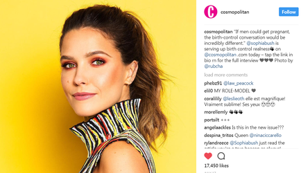 A close-up portrait of a young woman with long dark hair styled in a high ponytail. She is wearing a colorful striped dress with a high neckline and is looking directly at the camera with a slight smile on her face. The background is a bright yellow color. On the right side of the image there is a text that reads "Cosmopolitan" and on the left side there are comments from the user.
