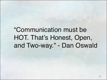 A quote by Dan Oswald that reads "Communication must be HOT. That's Honest Open and Two-way." The quote is written in black text on a light blue background. The text is in a simple sans-serif font and is centered on the image. The author's name is written at the bottom right corner of the image in a smaller font size.