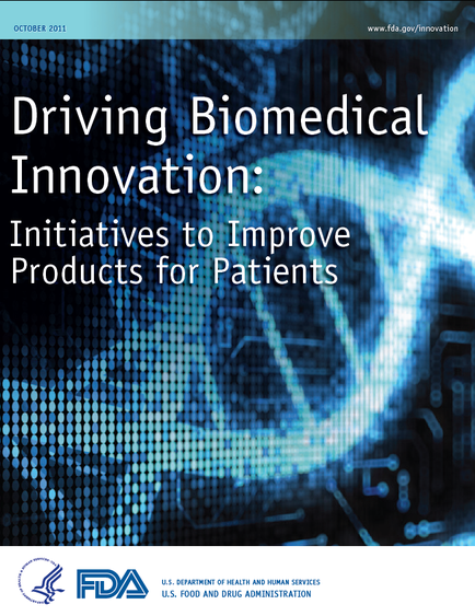 A cover page of a report titled "Driving Biomedical Innovation: Initiatives to Improve Products for Patients". The background is a dark blue color with a pattern of small white dots. In the center of the page there is a large image of a DNA strand in the shape of a heart. The DNA strand is outlined in white and is surrounded by a white border. The title of the report is written in bold white letters at the top with the subtitle "October 2011" written in smaller white letters below it. The FDA logo is also visible in the bottom right corner.