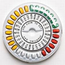 Of a circular pill dispenser. The dispenser has three concentric circles. The outmost ring has 28 pills in varying colors. There are seven green six red five white and ten yellow pills. An arrow appears to indicate to start with the green pills and continue clockwise. The center ring has abbreviations of days of the week for four weeks each day of the week corresponding with one of the pills. The center of the dispenser has a circle labeled "Use coin to set starting day". There is a slot to fit a coin which appears as though it would turn the center ring. The dispenser is made of white plastic and is set against a white background. 