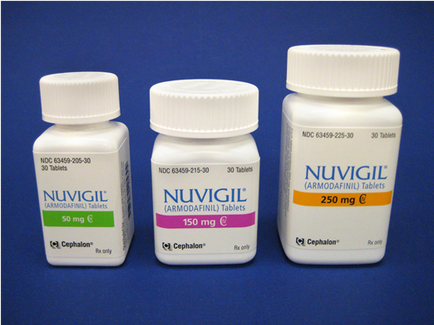 Three white plastic bottles with white caps. The bottles are labeled with the brand name "vigil" and the product name "ARMODAFINIL TABLETS". The bottle on the left is 50 mg the bottle in the middle is 150 mg and the one on the right is 250 mg. All three bottles have the same brand name and product name written on them. The background is a solid blue color.