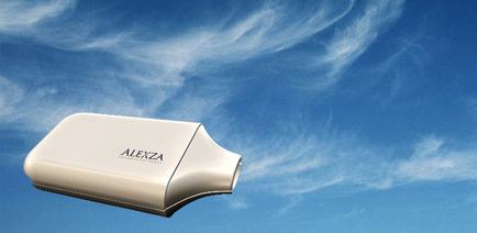 A white rectangular device with the word "alexia" written on it in black letters. The device appears to be an air purifier or a humidifier with a sleek and modern design. It is flying in the sky with the blue sky and white clouds in the background. The clouds are arranged in a wavy pattern creating a sense of movement and energy. The overall mood of the image is peaceful and serene.