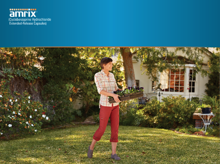 A young woman walking in a garden. She is wearing a white shirt red pants and gray shoes. She has short dark hair and is carrying a wooden crate filled with purple flowers. The garden is well-maintained with a variety of plants and trees and there is a white house in the background. The sky is blue and the overall mood of the image is peaceful and serene.
