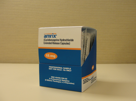 A blue and white box of Amrix (Cyclobenzine Hydrochloride Extended-Release Capsules) with the brand name "Amrix" written in bold orange letters on the top left corner. The box is rectangular in shape and has a clear plastic window on the right side. The front of the box has a label that reads "15 mg" in white letters. Below the label there is a description of the product which states that it is a professional sample not for sale. The label also mentions that the product is not available for sale only. The background is a plain beige color.
