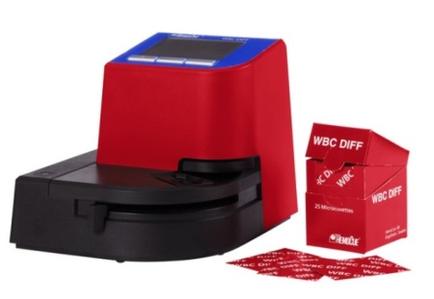 A red-colored WBC riff (WBC riff) machine with a blue-colored LCD screen on top. The machine has a black base and a black lid. Next to the machine there is a small red box with the WBC riff logo on it. The box is open and there are several red cards scattered around it. On the right side of the image there are two smaller red boxes with the same logo on them. The background is white.